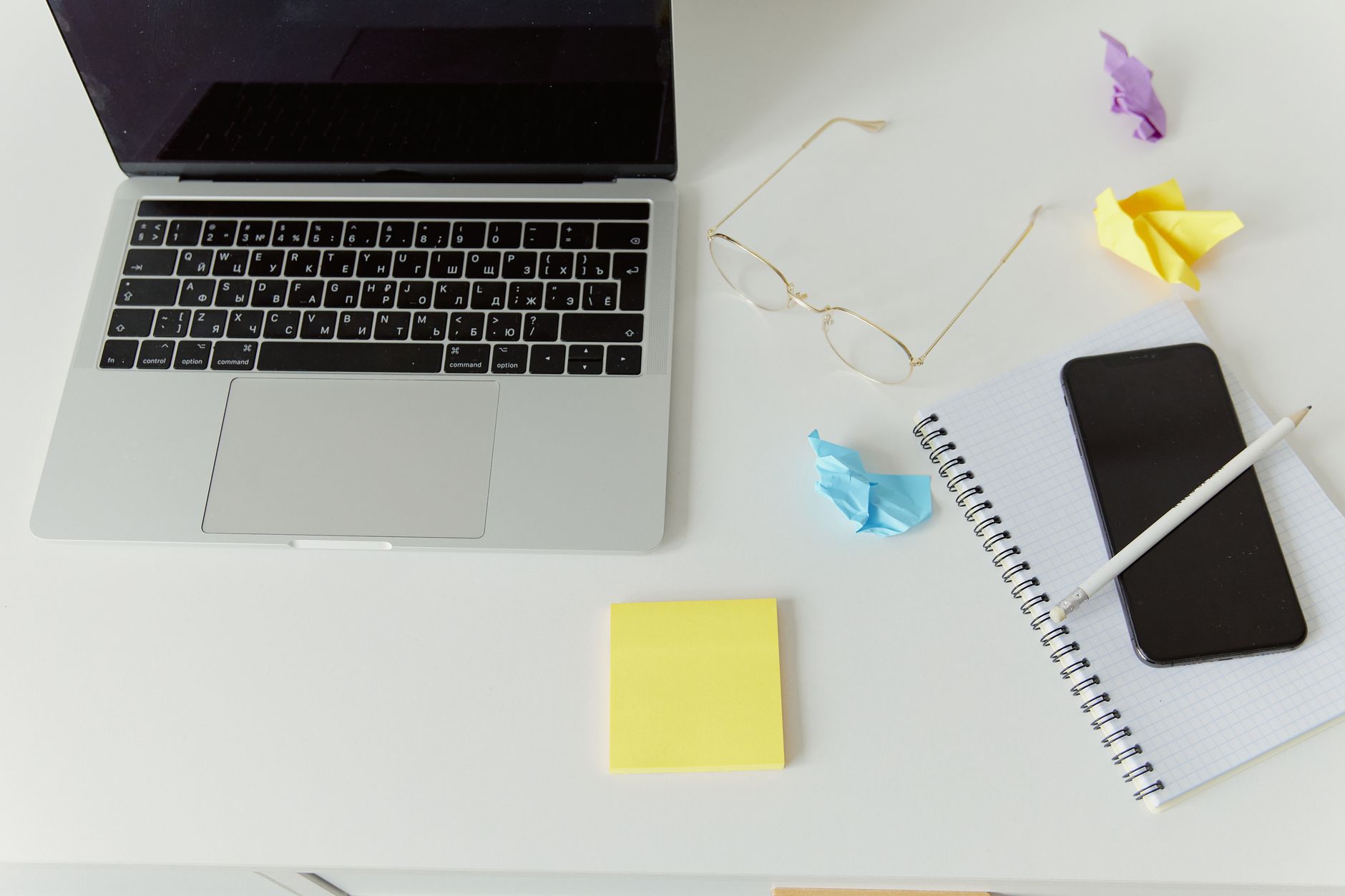 Travel advisor reviewing trip notes at a tidy desk with a laptop and printed itinerary